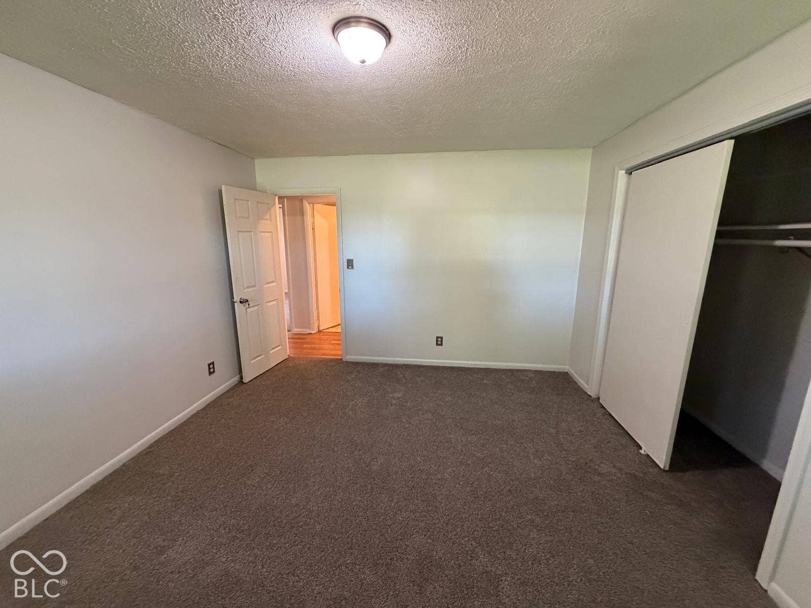 2819 E Edgewood Avenue, Indianapolis, IN 46227 Carpeted flooring, white walls, and a closet with bi-fold doors
