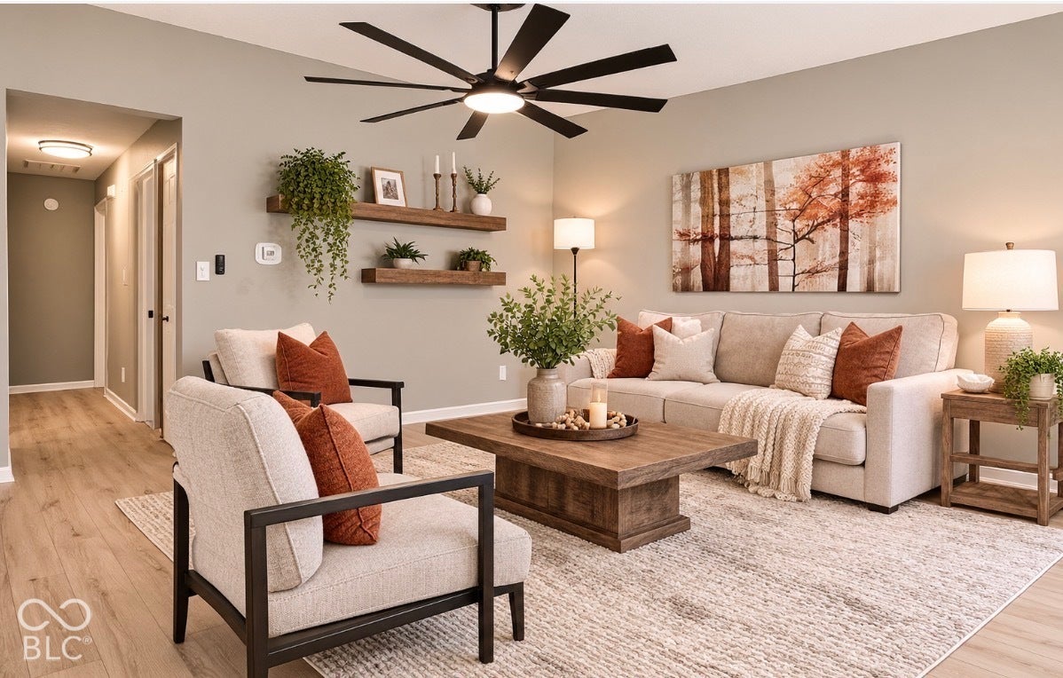 Virtually Altered - Vaulted ceiling with a large ceiling fan, recessed lighting, wood-finish flooring, and two floating wall shelves