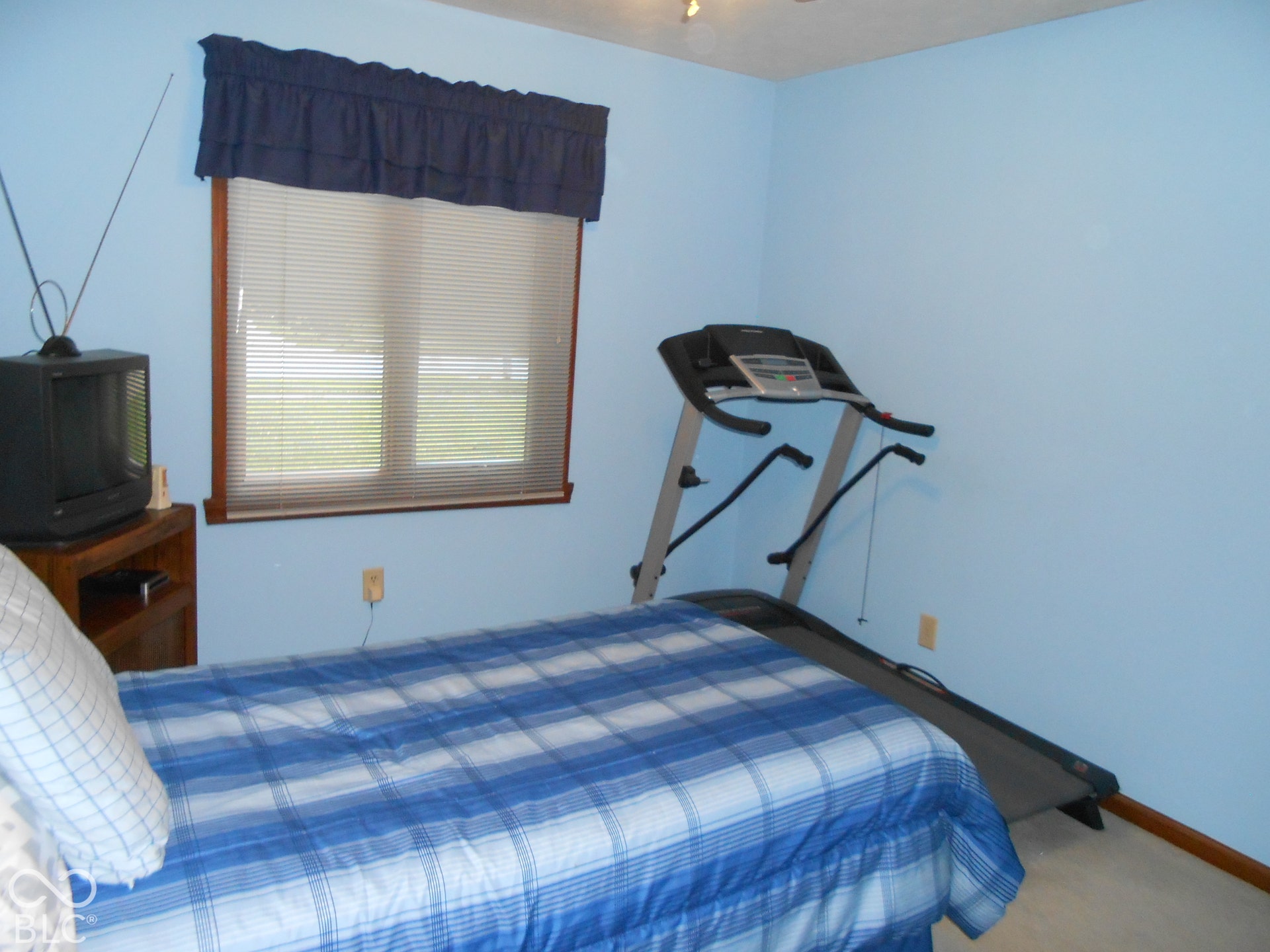 Hardwood-framed window with horizontal blinds