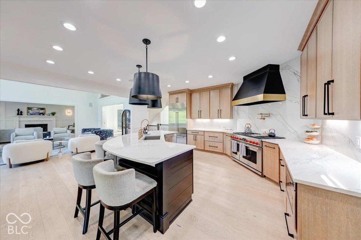 Open-concept living area with light wood-finish flooring
