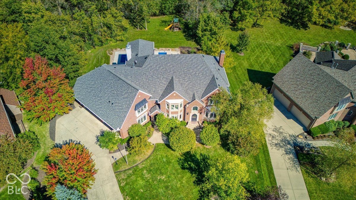 Brick exterior with multiple gables and a multi-level shingle roof