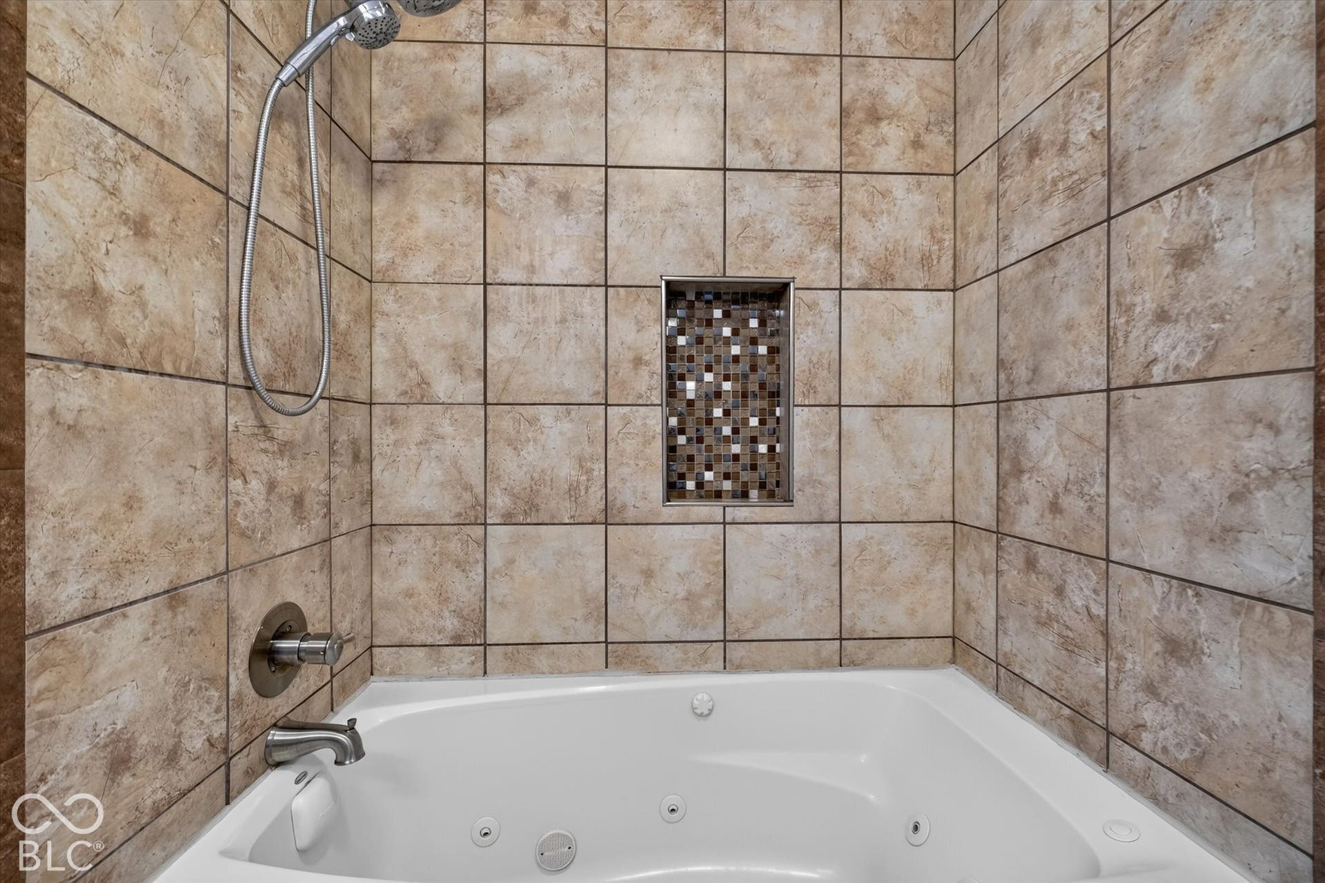 Primary bathroom featuring a pedestal sink and a tiled shower/bathtub combination