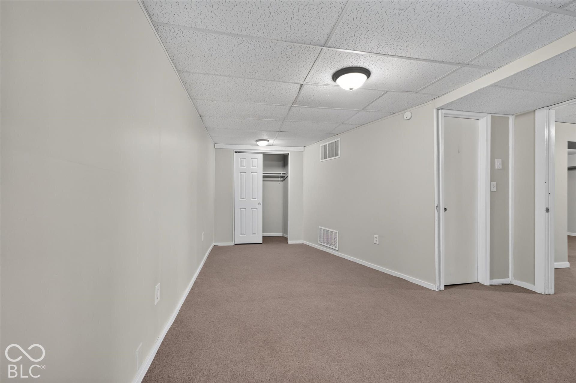 Spacious 4th bedroom featuring carpet and outside access
