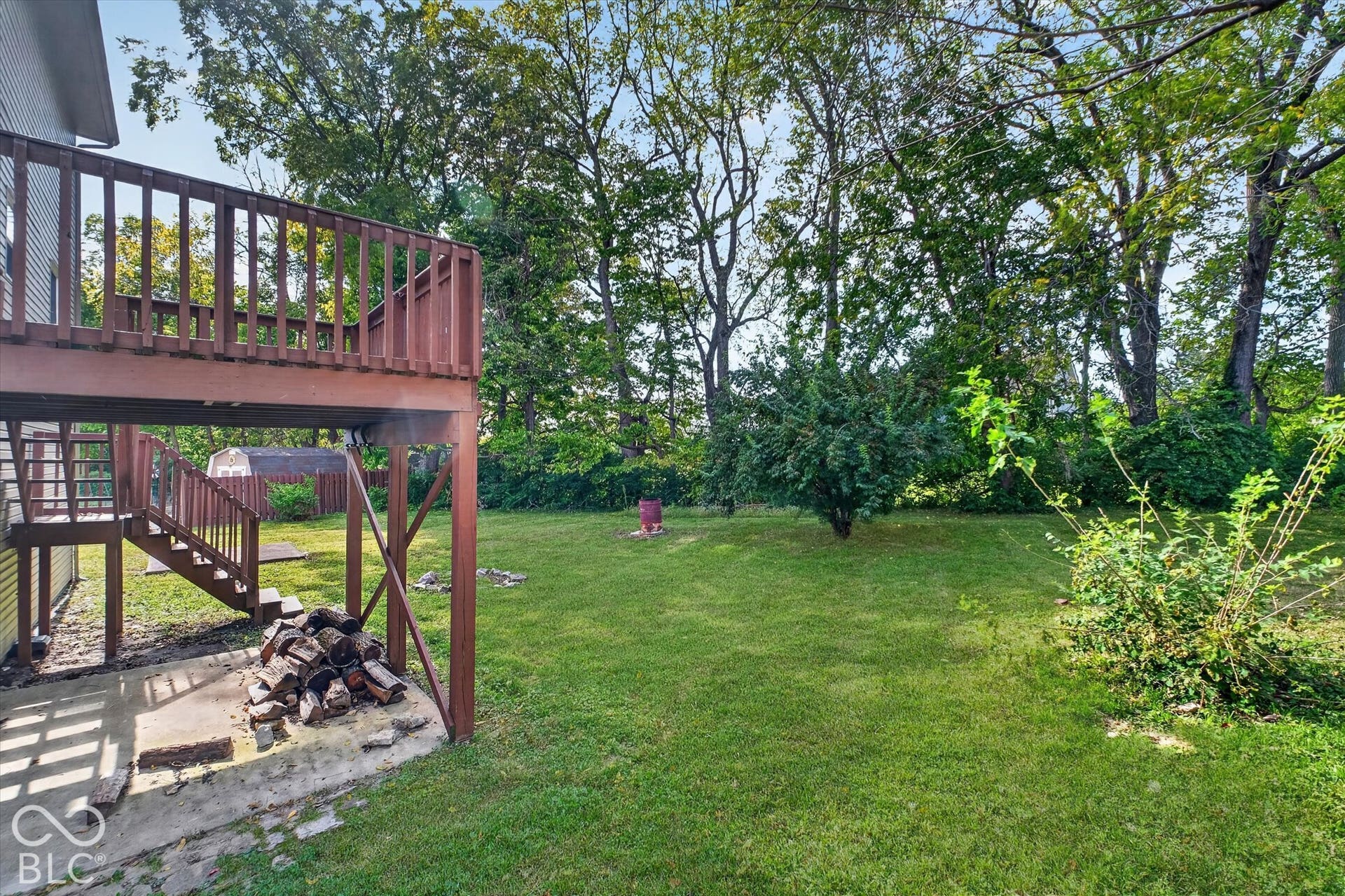 Expansive backyard with mature trees