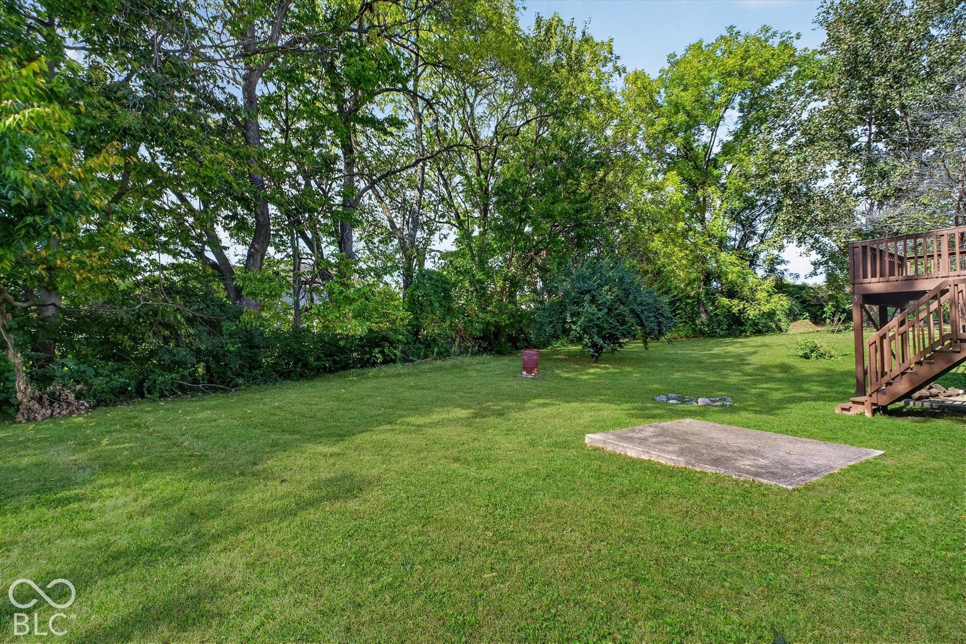 Expansive backyard with mature trees