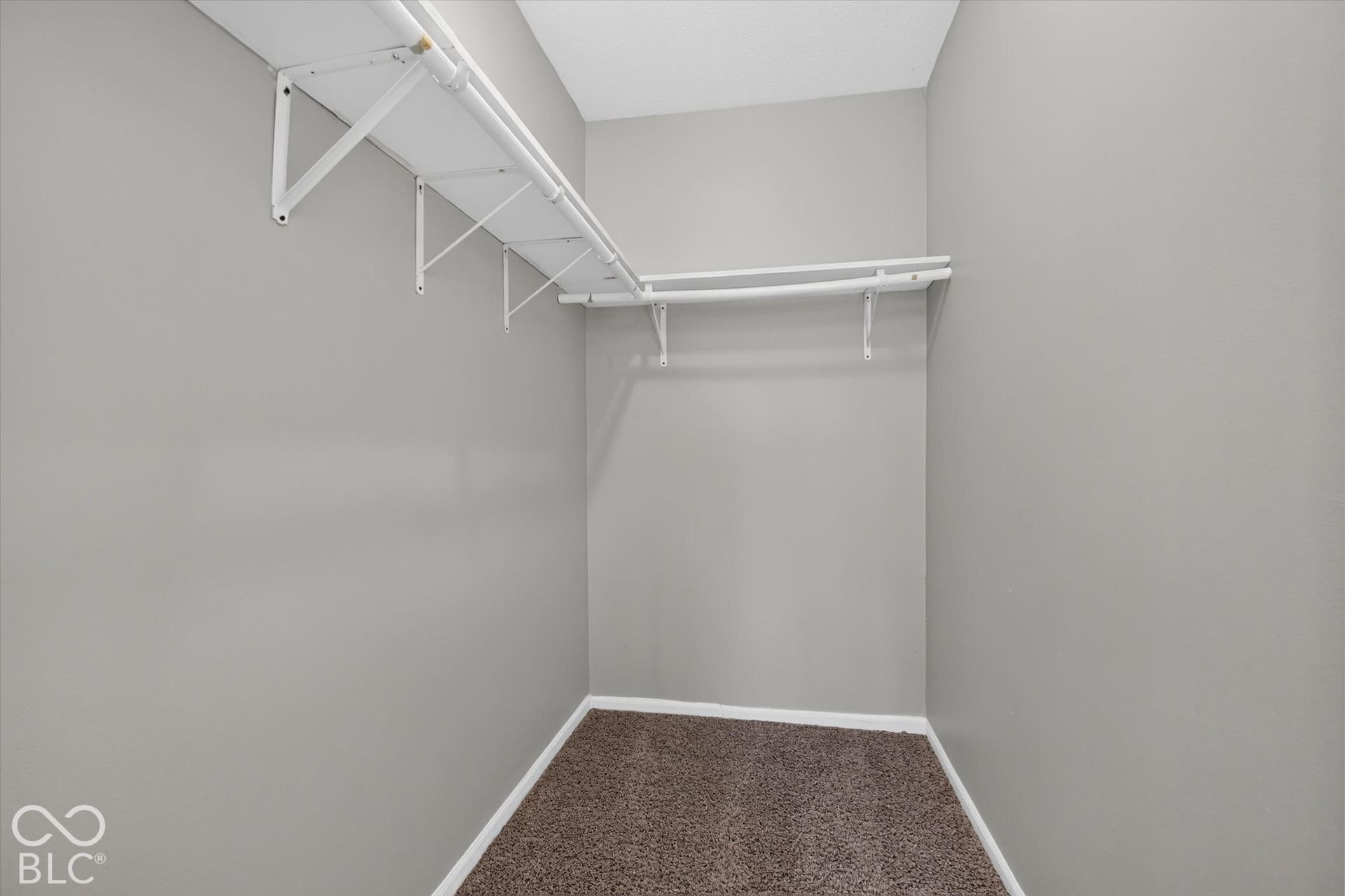 View of walk in closet for primary bedroom