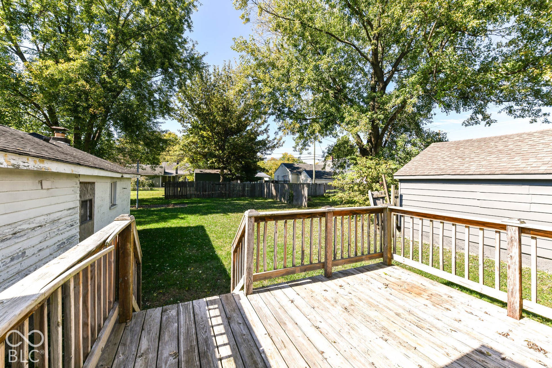 896 Young Street, Franklin, IN 46131 Fantastic wood deck overlooks the backyard, surrounded by mature shade trees, and wood-fence.