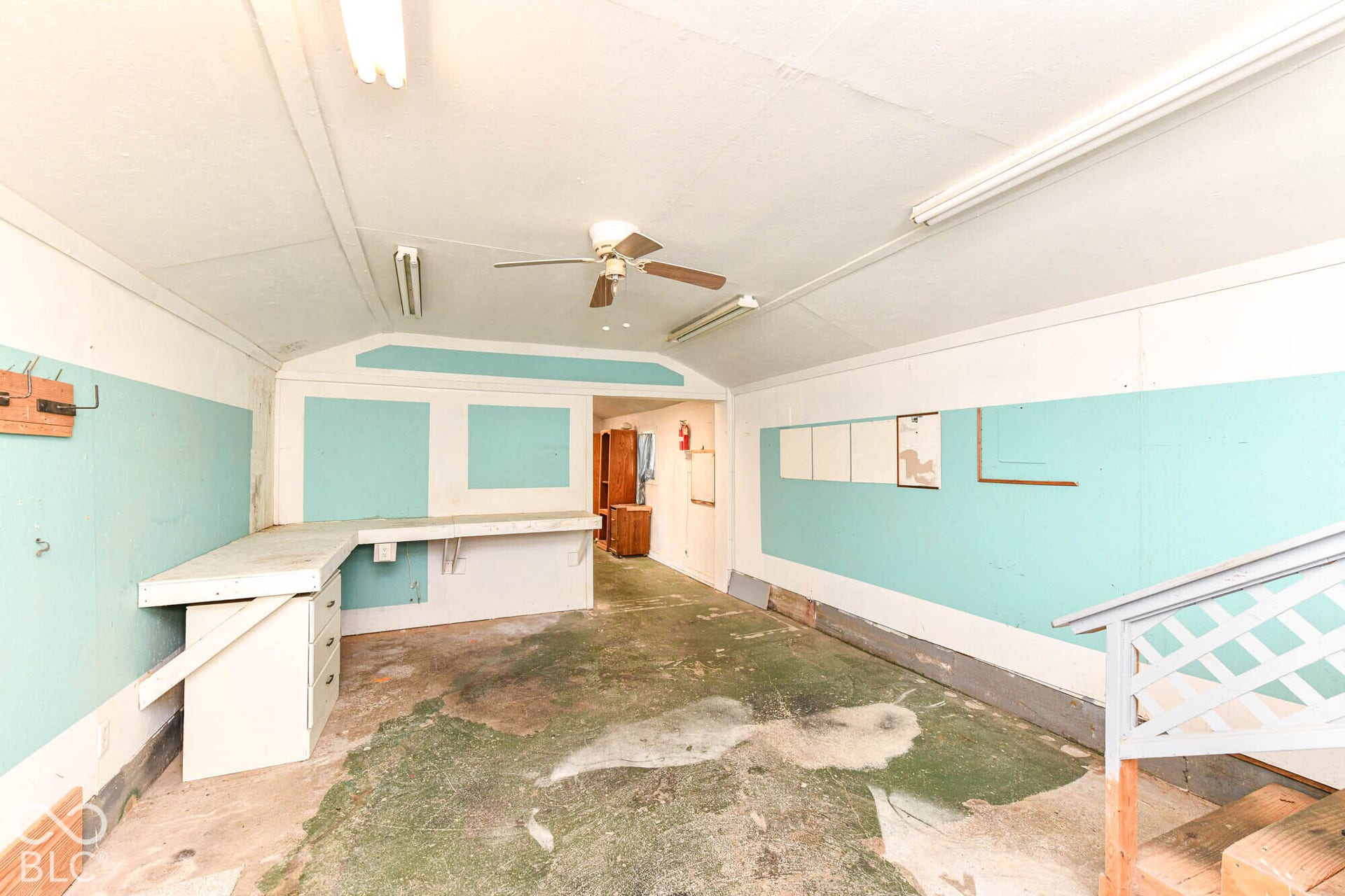 896 Young Street, Franklin, IN 46131 Portion of carport has been enclosed for use as workshop with built-in wooden workbench.