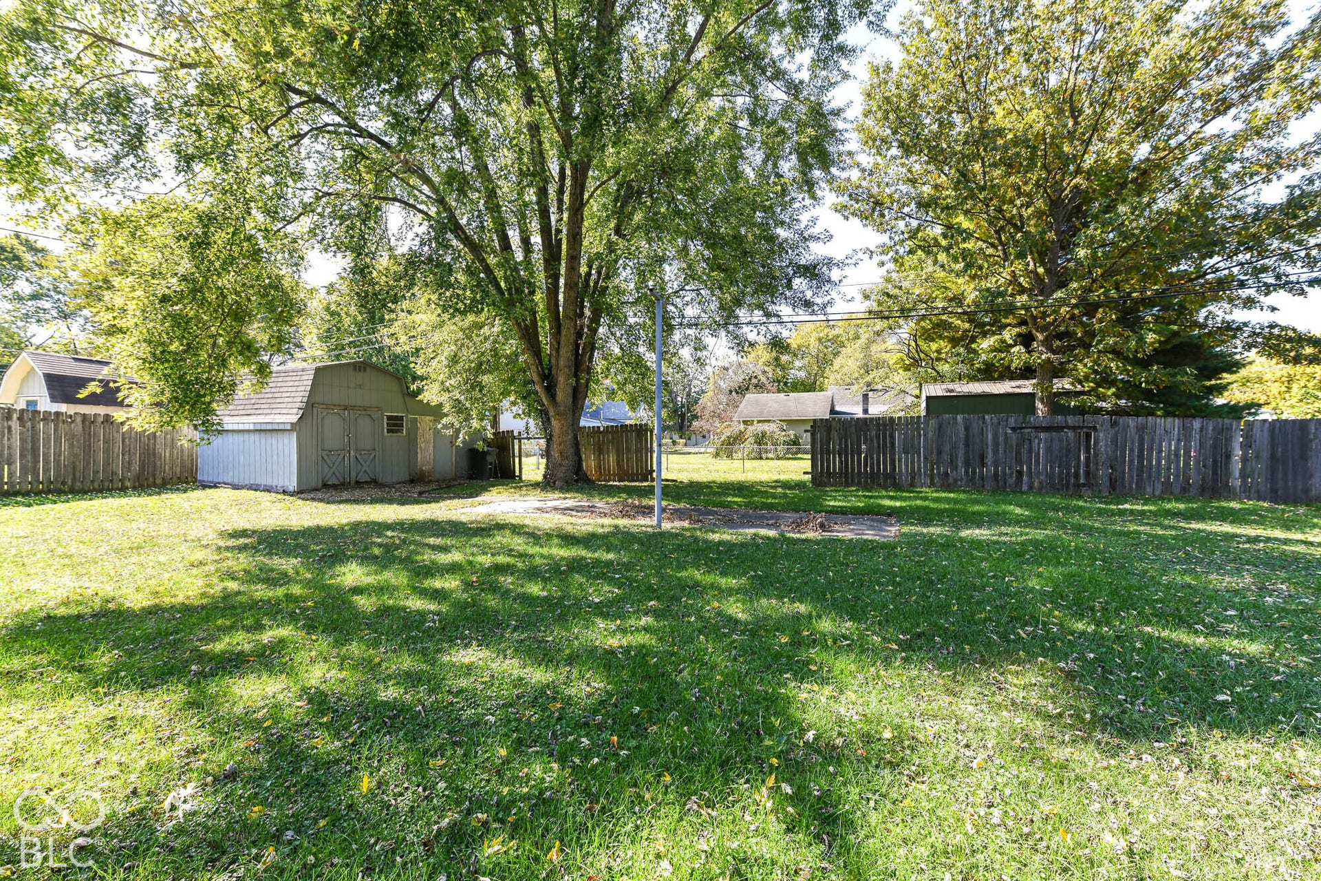 896 Young Street, Franklin, IN 46131 Spacious backyard includes a storage shed and wood fence.