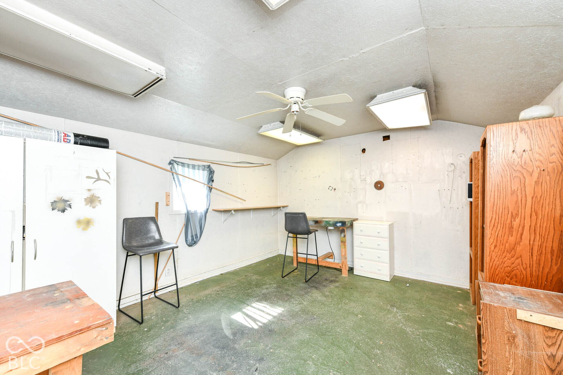 896 Young Street, Franklin, IN 46131 Behind the workshop is another workspace with additional storage & shelving.