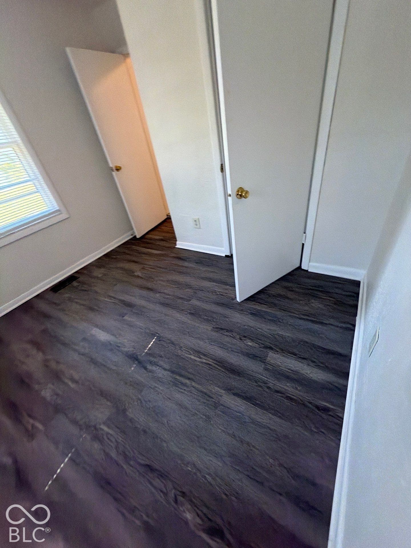 Wood-finish flooring with white trim