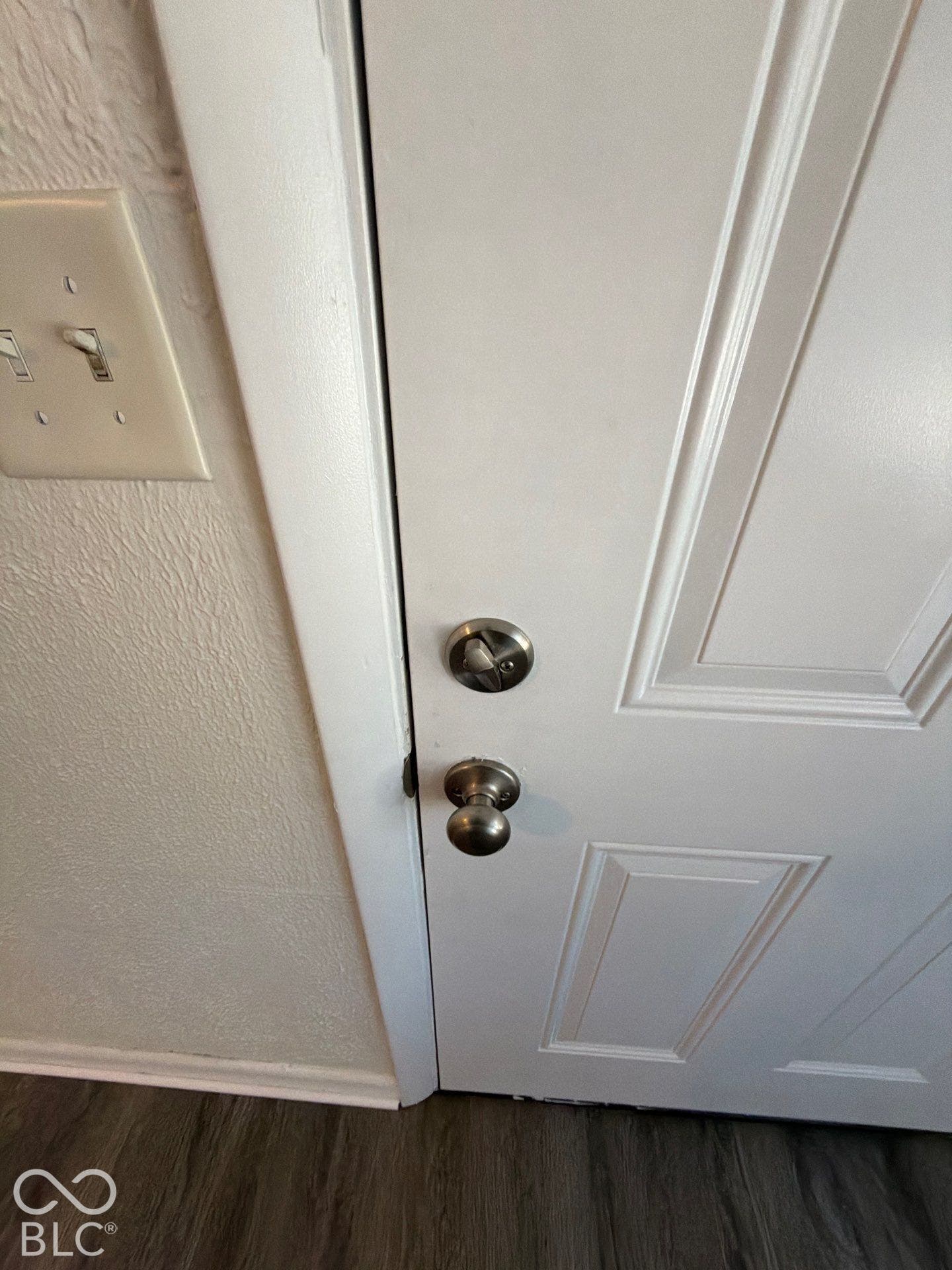 White paneled door with brushed nickel hardware