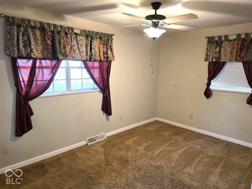 This room has newer carpeting and faces the front of the home
