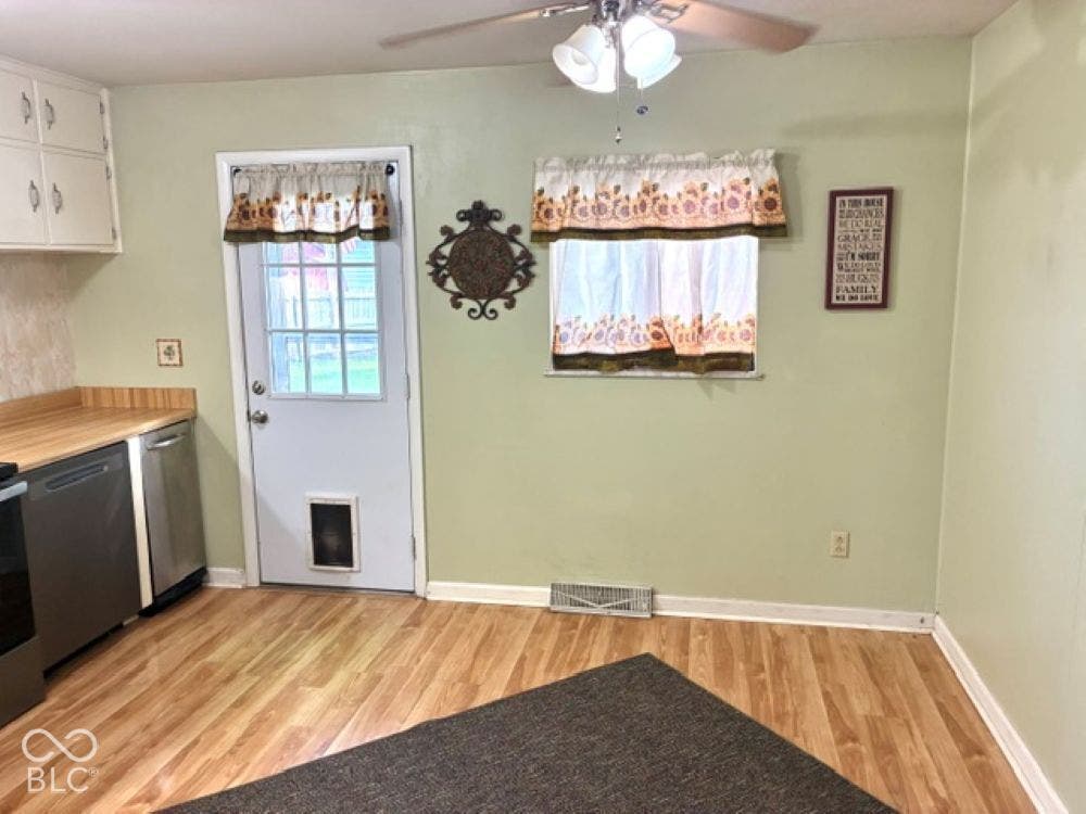 This country kitchen includes plenty of room for a table and chairs for casual dining.