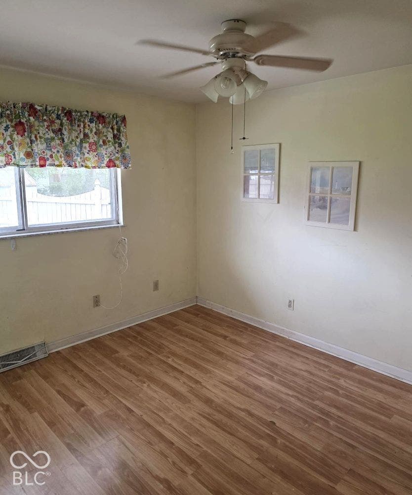 Located just off the kitchen, this room could be a dining room or perhaps a playroom or an office.