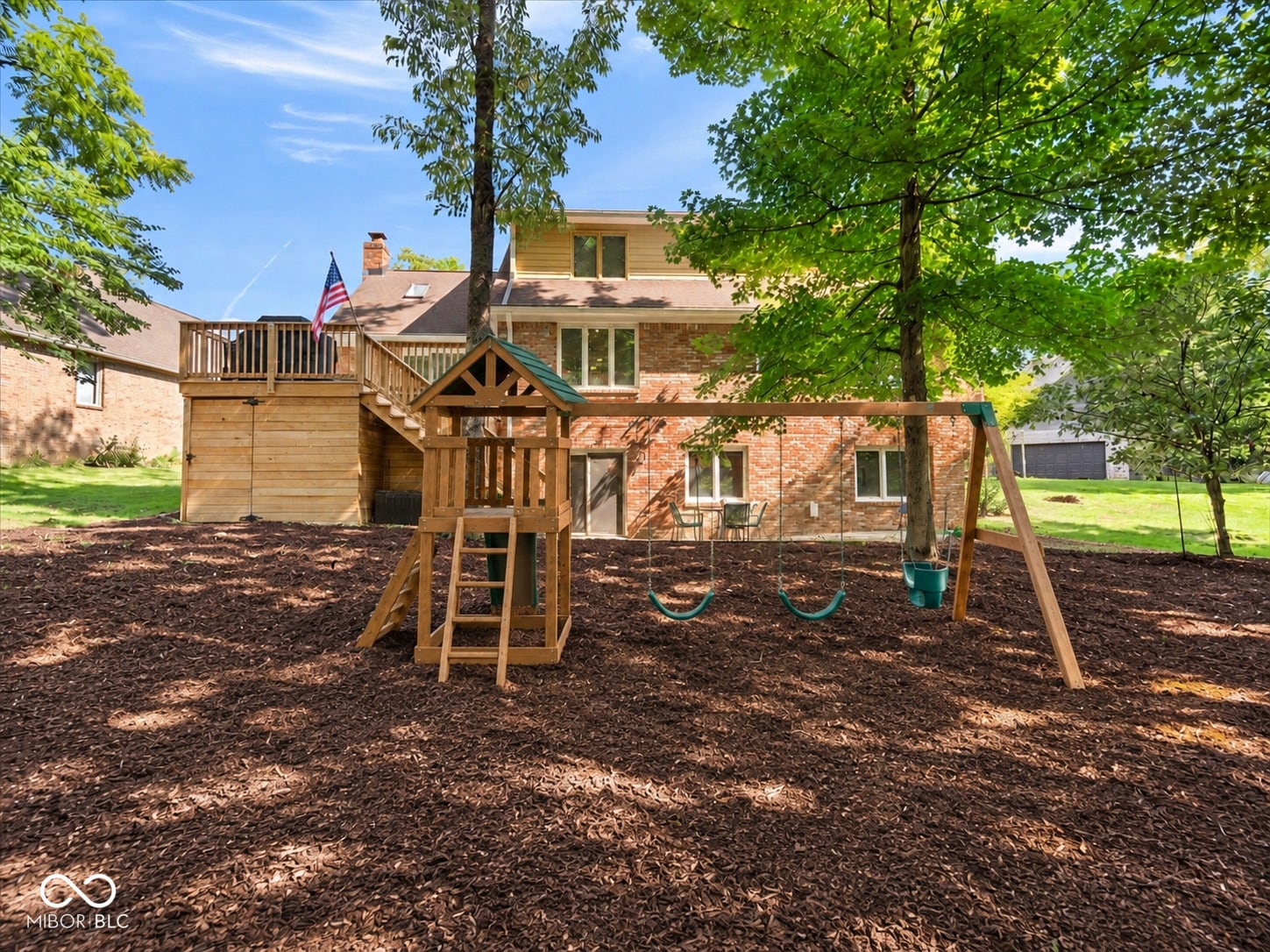 Virtually Altered - Virtually enhanced to show the potential of the backyard with added mulch and swing set.