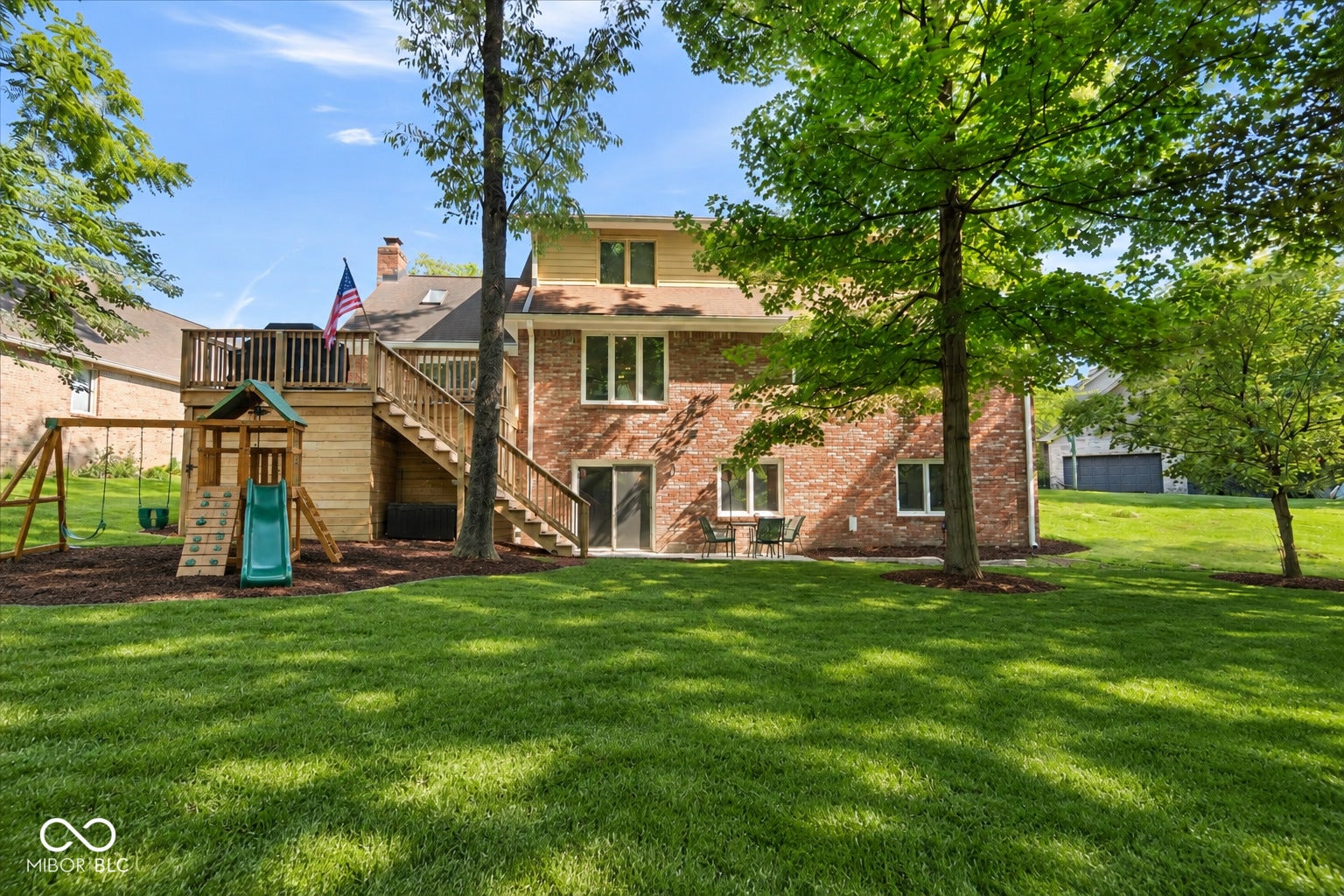 Virtually Altered - Virtually enhanced to show the potential of the backyard with added grass/sod, mulch, and swing set.