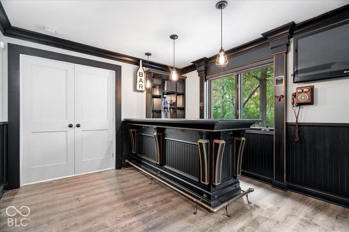 Basement bar that leads into 4th bedroom/bonus room for extra living space.