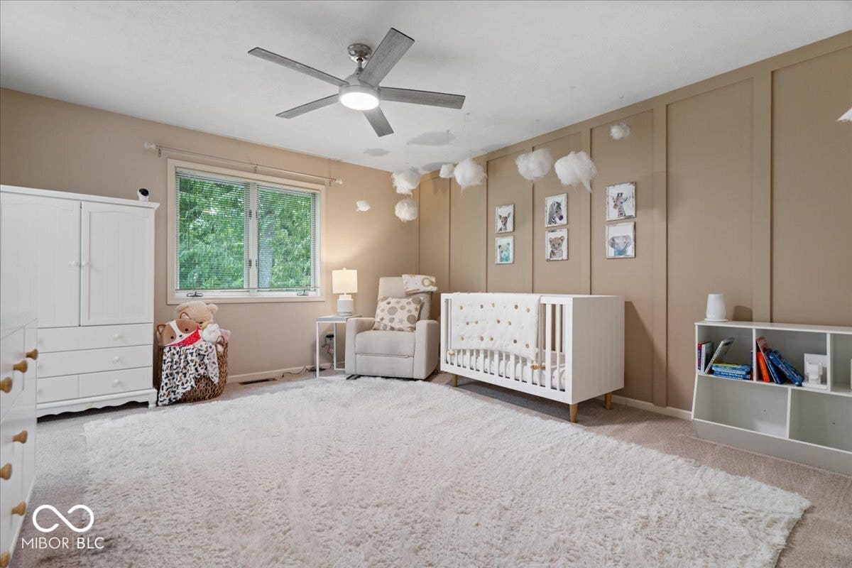 Another spacious bedroom with an accent wall