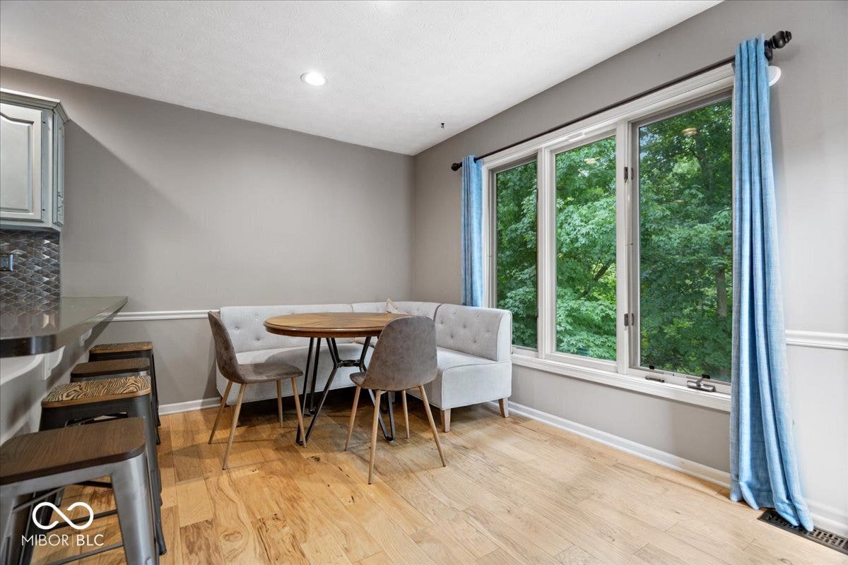 Eat in kitchen with large picture windows overlooking beautiful wooded backyard.