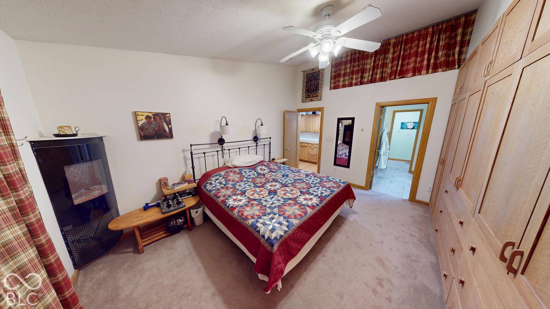Bedroom #3 Vaulted ceiling with ceiling fan, built-in wardrobe cabinetry, and carpeted flooring