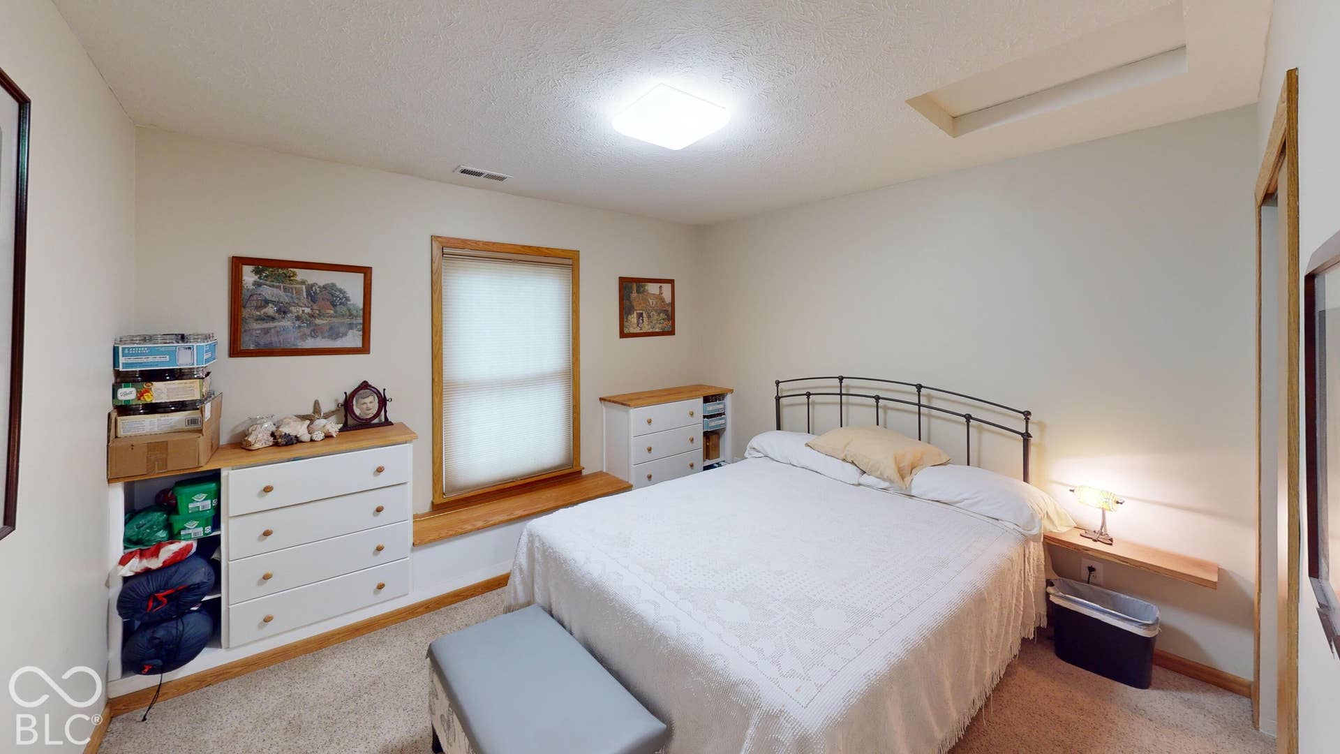 Bedroom #2 = Window with wood trim and integrated window seat