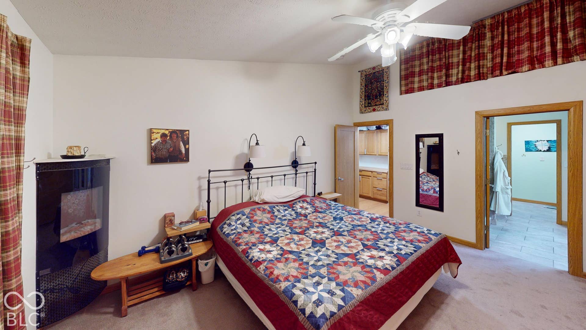 Bedroom #3 Recessed ceiling with decorative valance, ceiling fan with integrated lighting, and multiple doorways leading to additional rooms