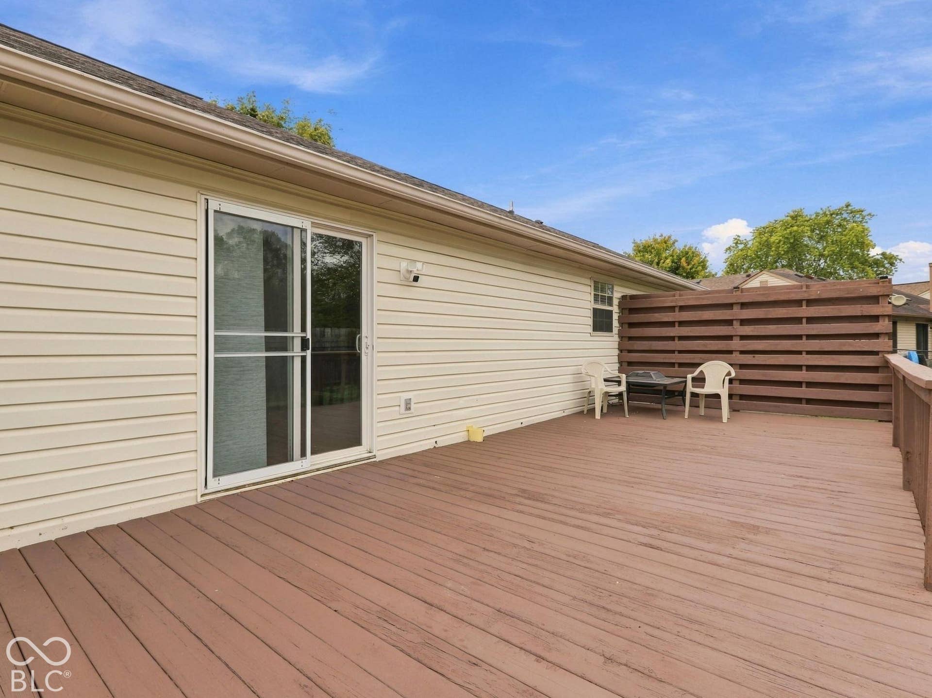 The large deck is positioned off of the family room
