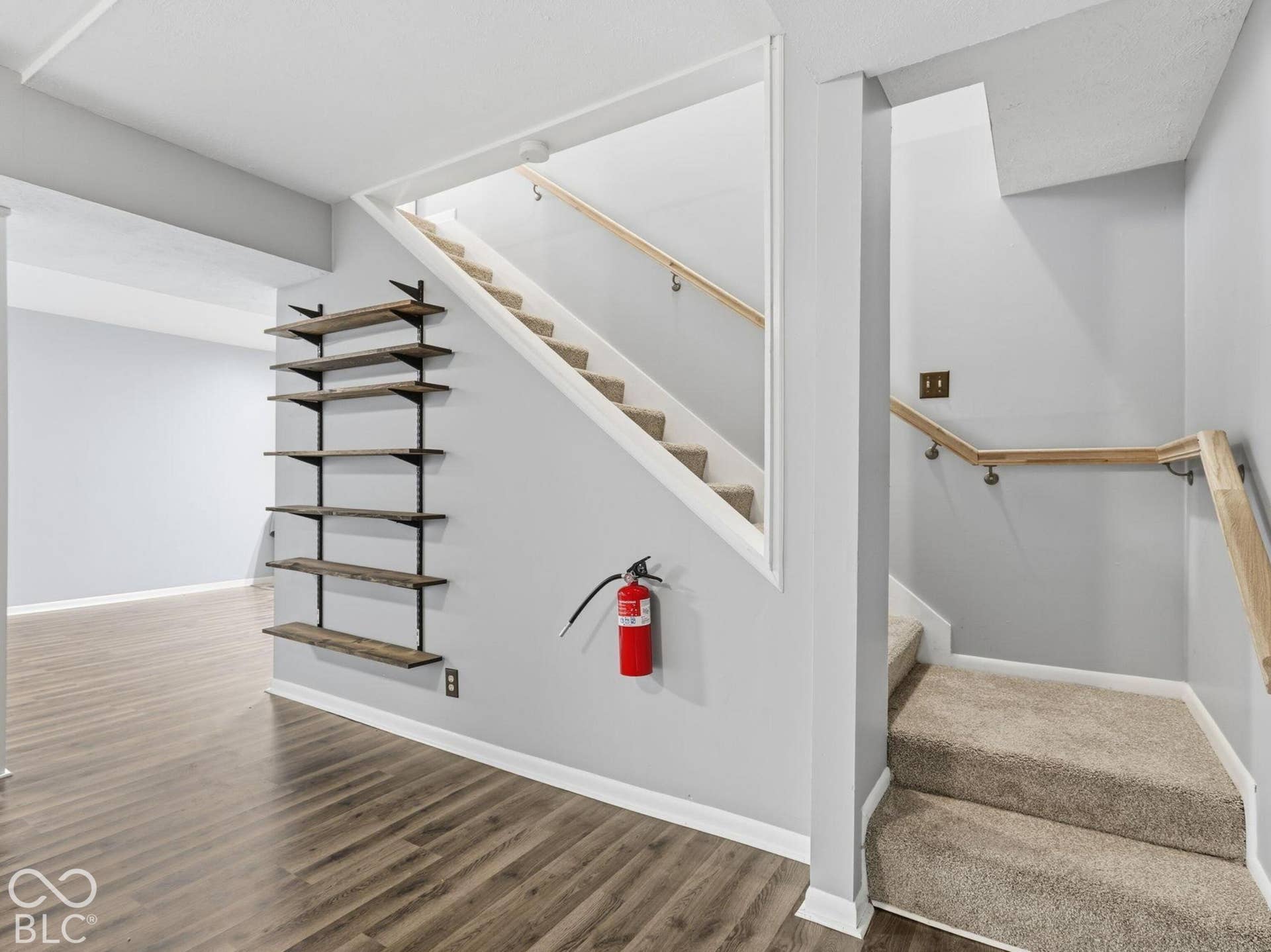 Basement with new carpet on stairs and hand rail installed