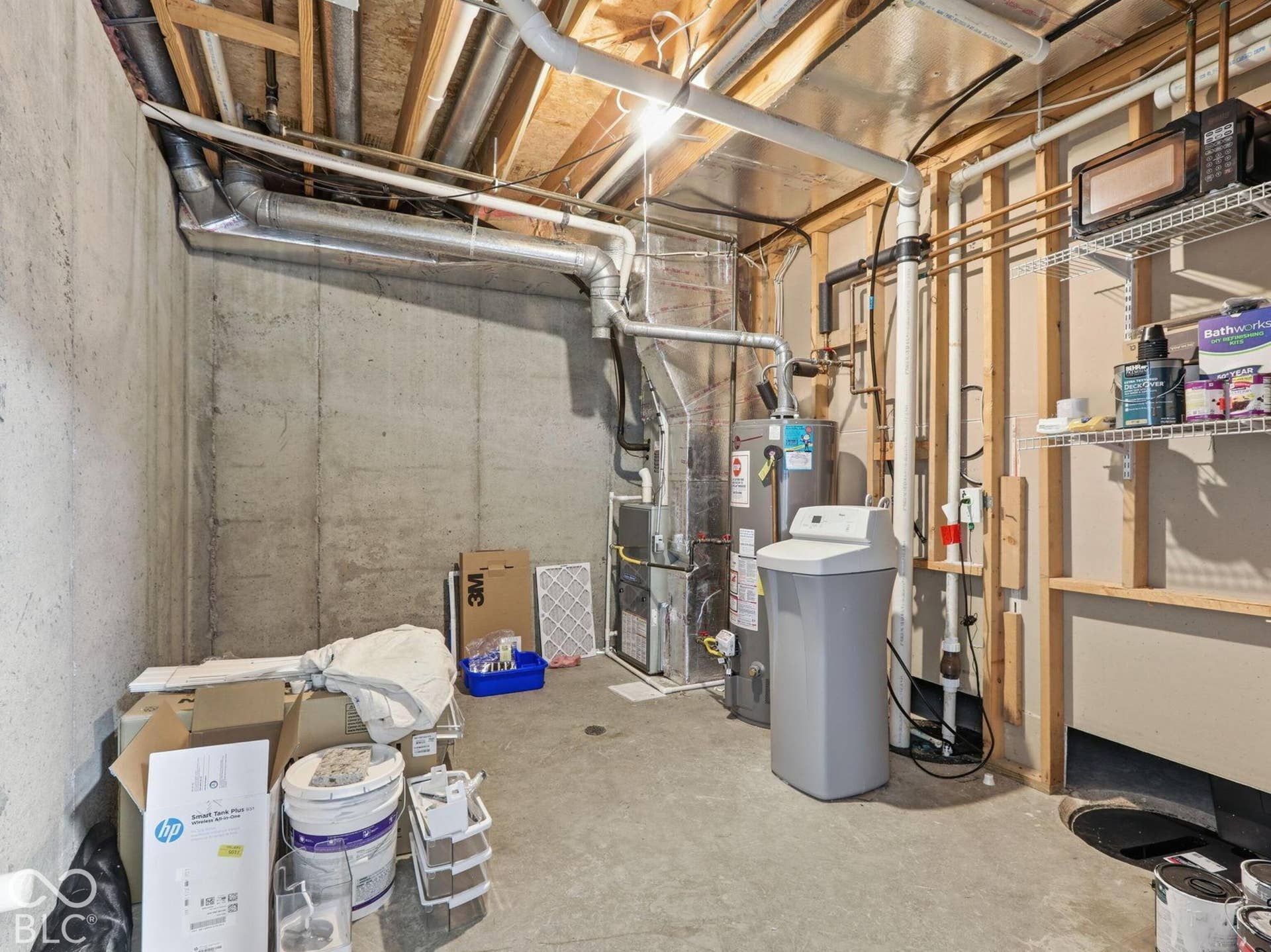 Mechanical room in basement offers storage and stubbed plumbing for an additional bath or wet bar