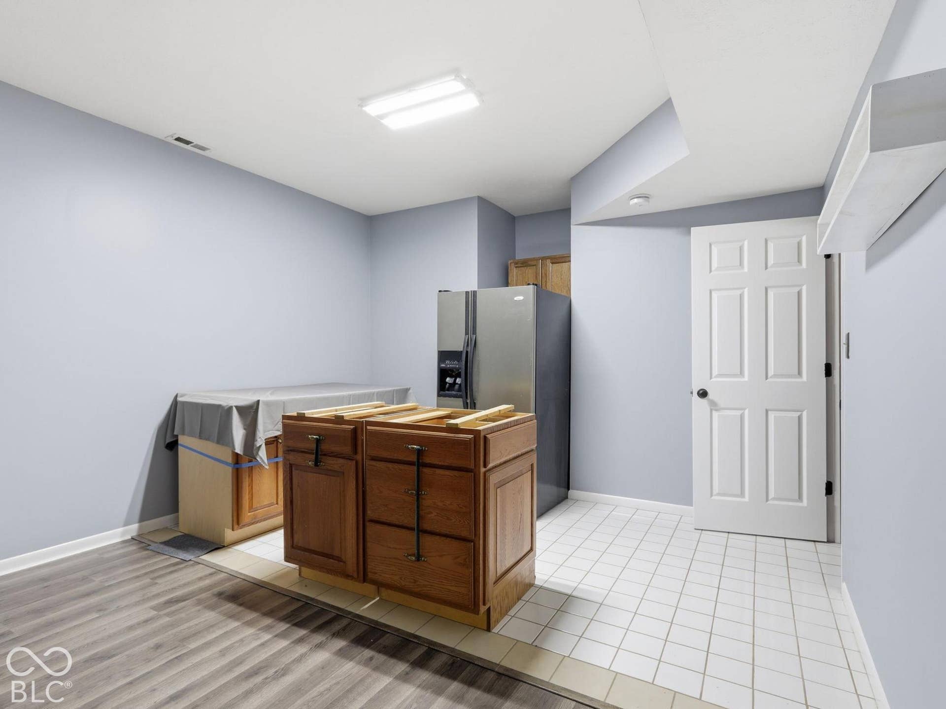 Cabinets and refrigerator stay with the house