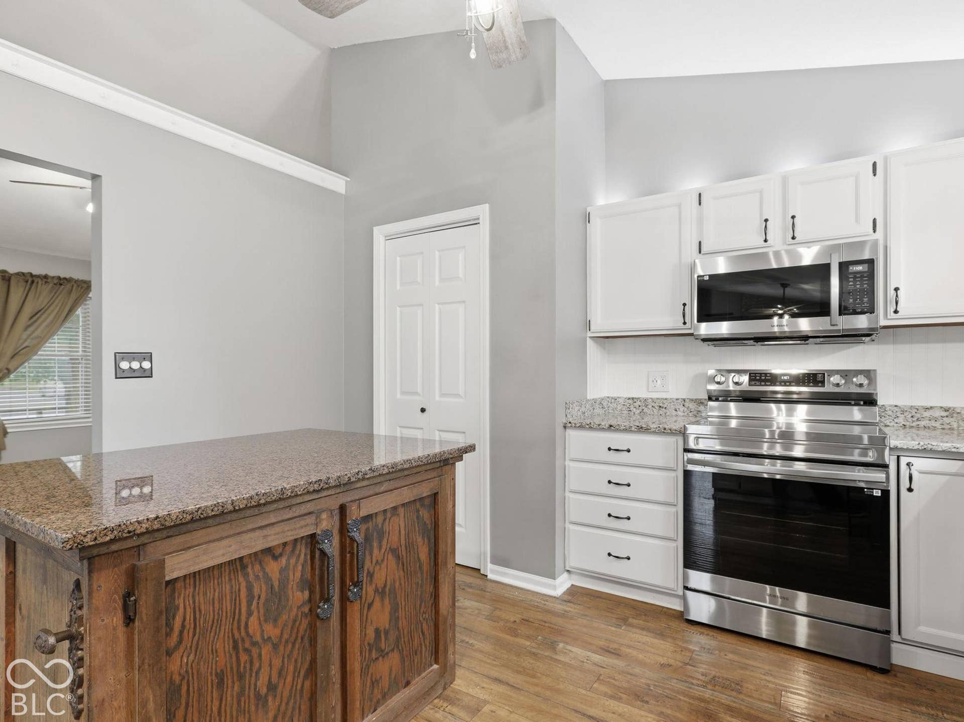 You enter the updated kitchen from the living room