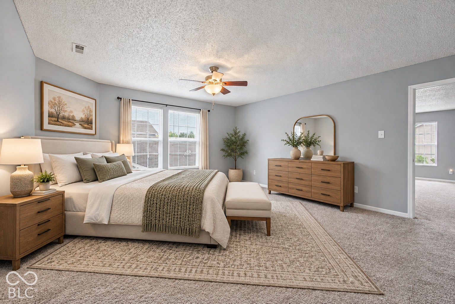 Virtually Altered - Neutral-toned interior room featuring wall-to-wall carpeting, dual-pane windows, and a ceiling fan with integrated lighting