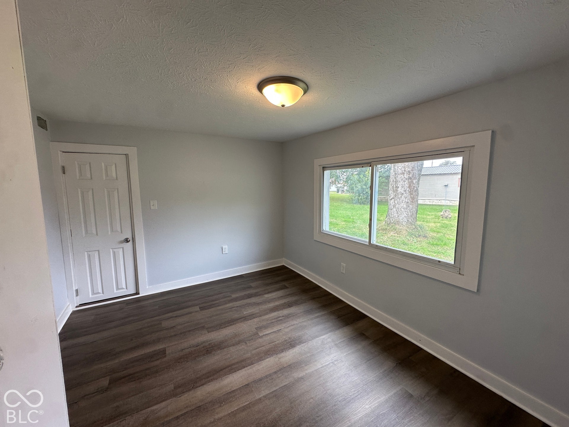 Wood-finish flooring with crisp white trim