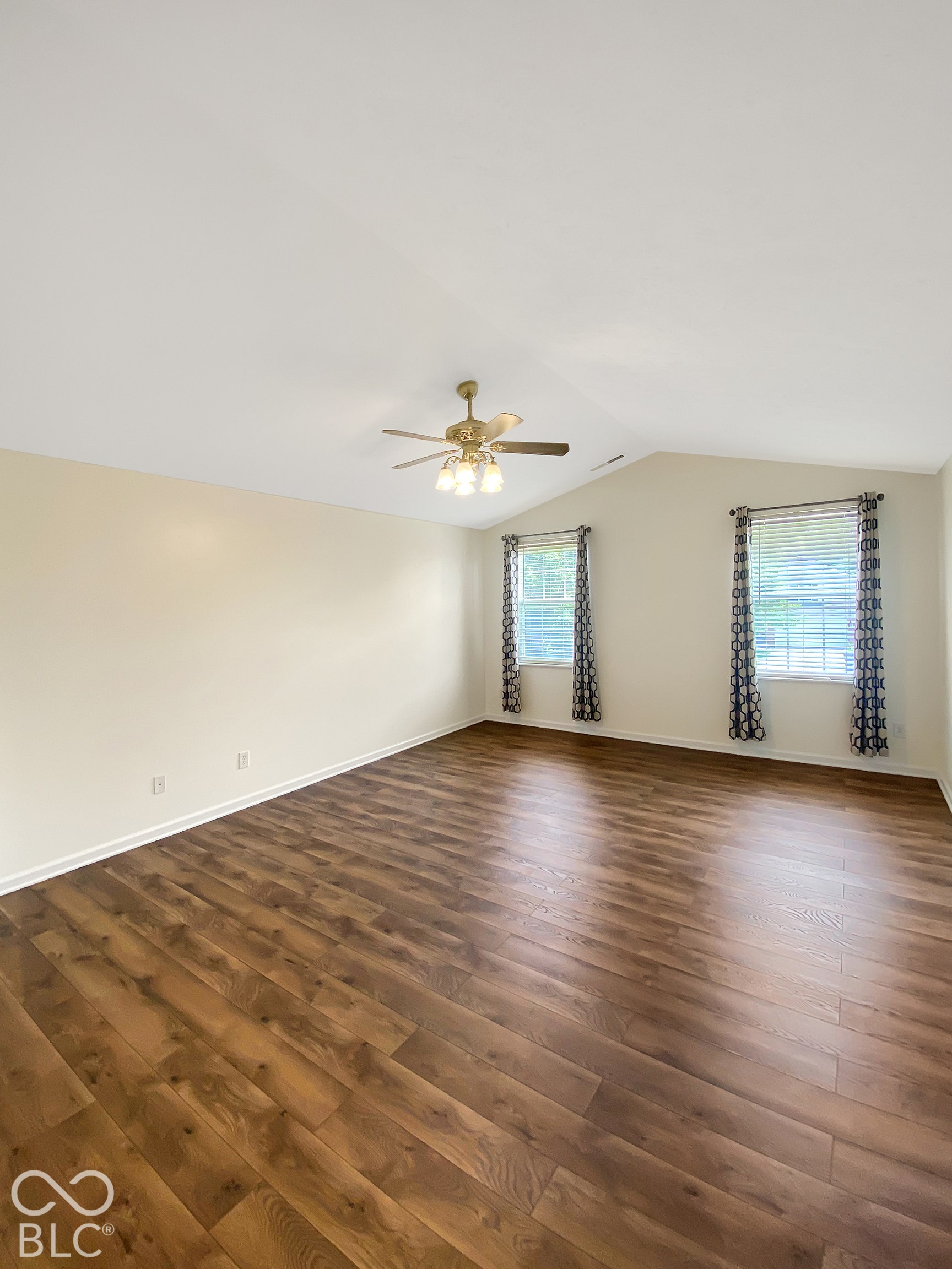 4726 Eva Court, Indianapolis, IN 46227 Vaulted ceilings, wood-finish flooring, and a central ceiling fan with integrated light fixture