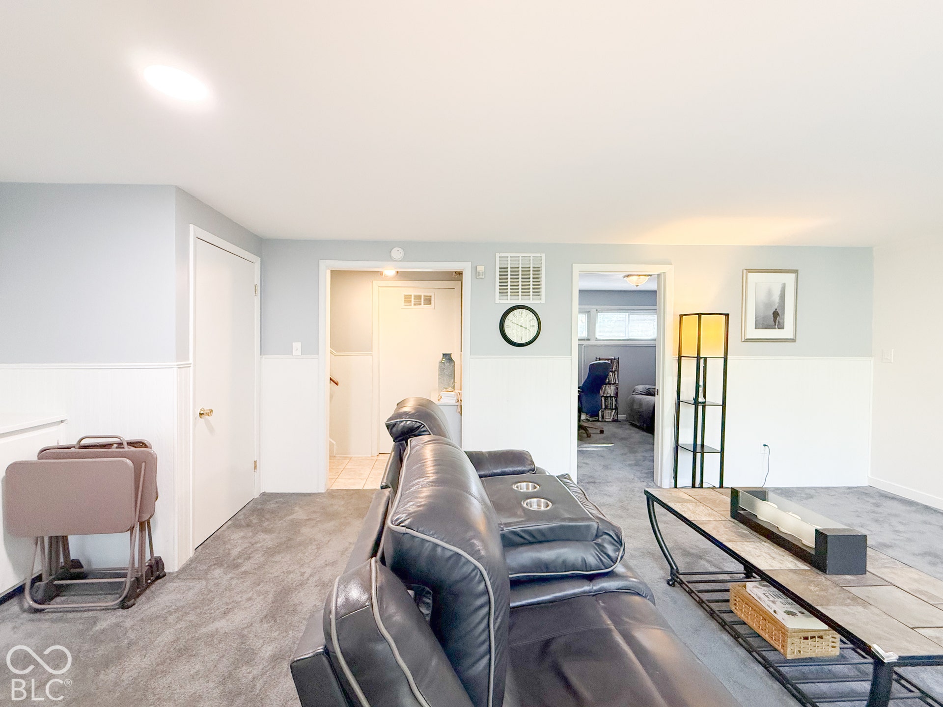4225 Westbourne Drive, Indianapolis, IN 46205 Interior space featuring dual-tone wall finishes with chair rail molding and carpeting