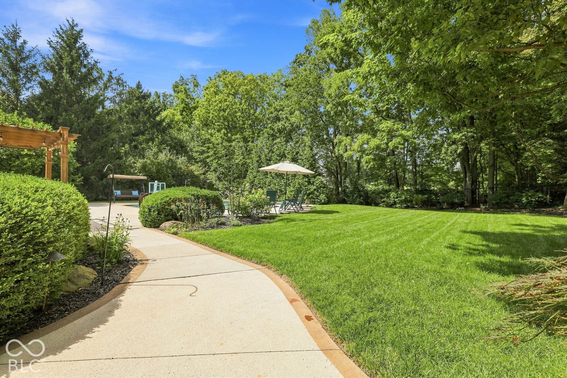 Surrounded by mature trees and lush landscape