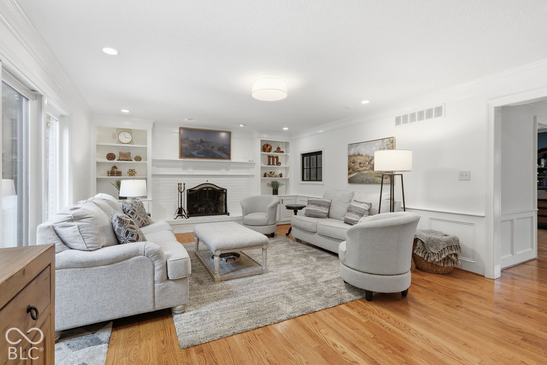 Refinished Hardwoods and Built-ins flanking gas fireplace