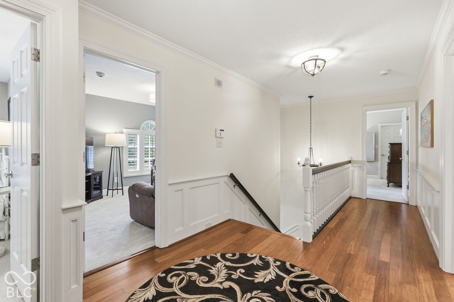 Landing with Hardwood Floors leading to Bedrooms