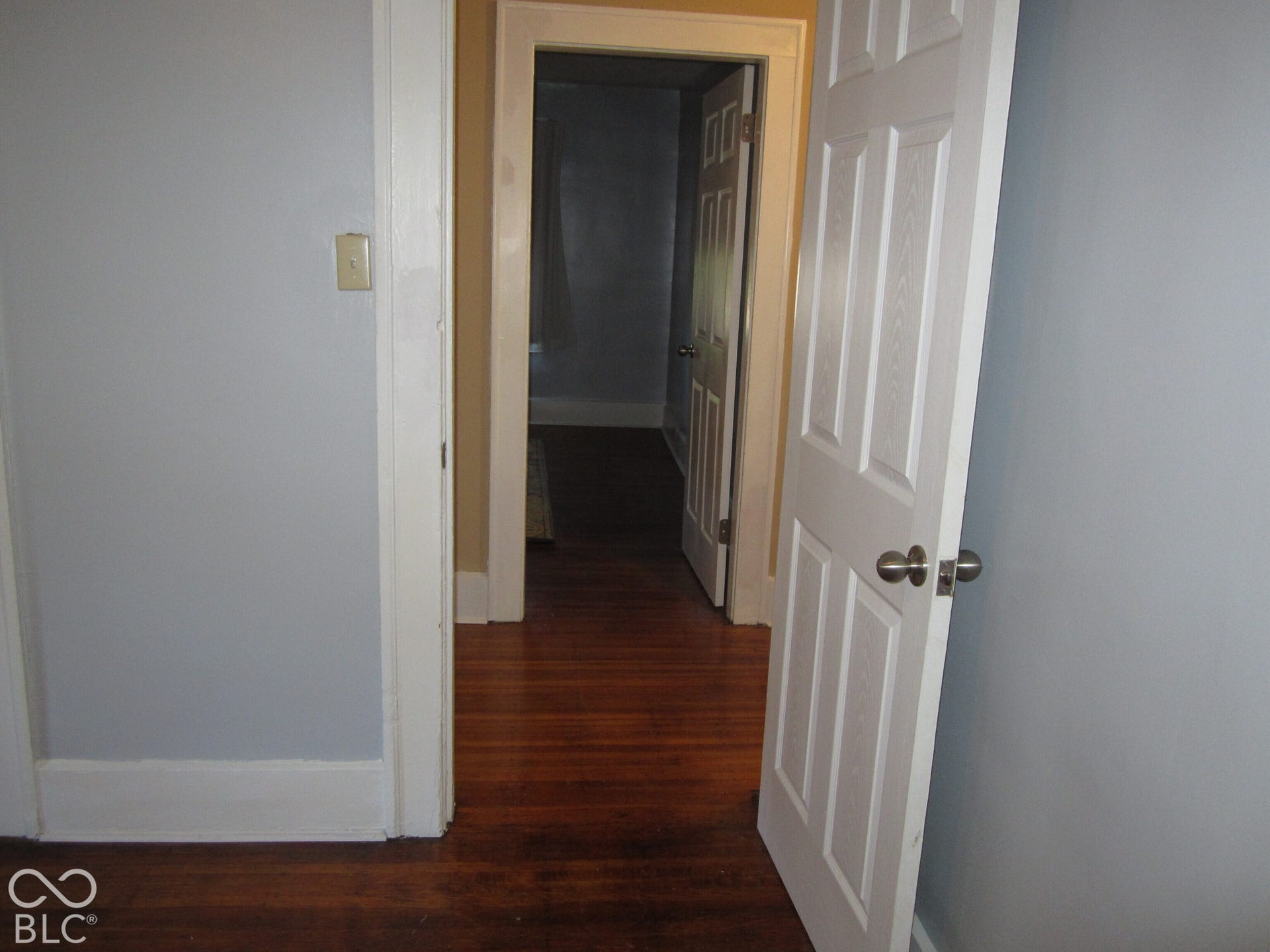 Hardwood flooring, six-panel interior doors, and door casing trim