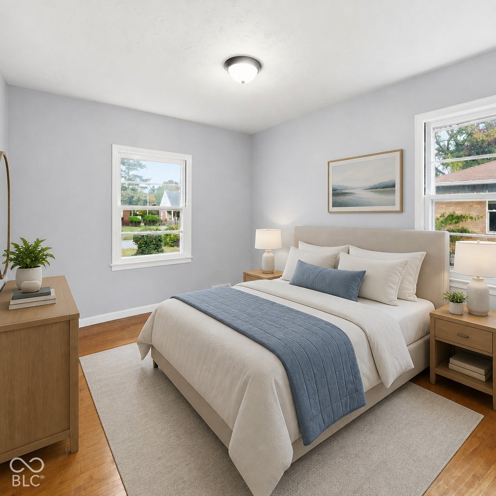 Bedroom featuring wood-finish flooring, dual windows with white trim, and a centered flush-mount ceiling light. Virtually altered.