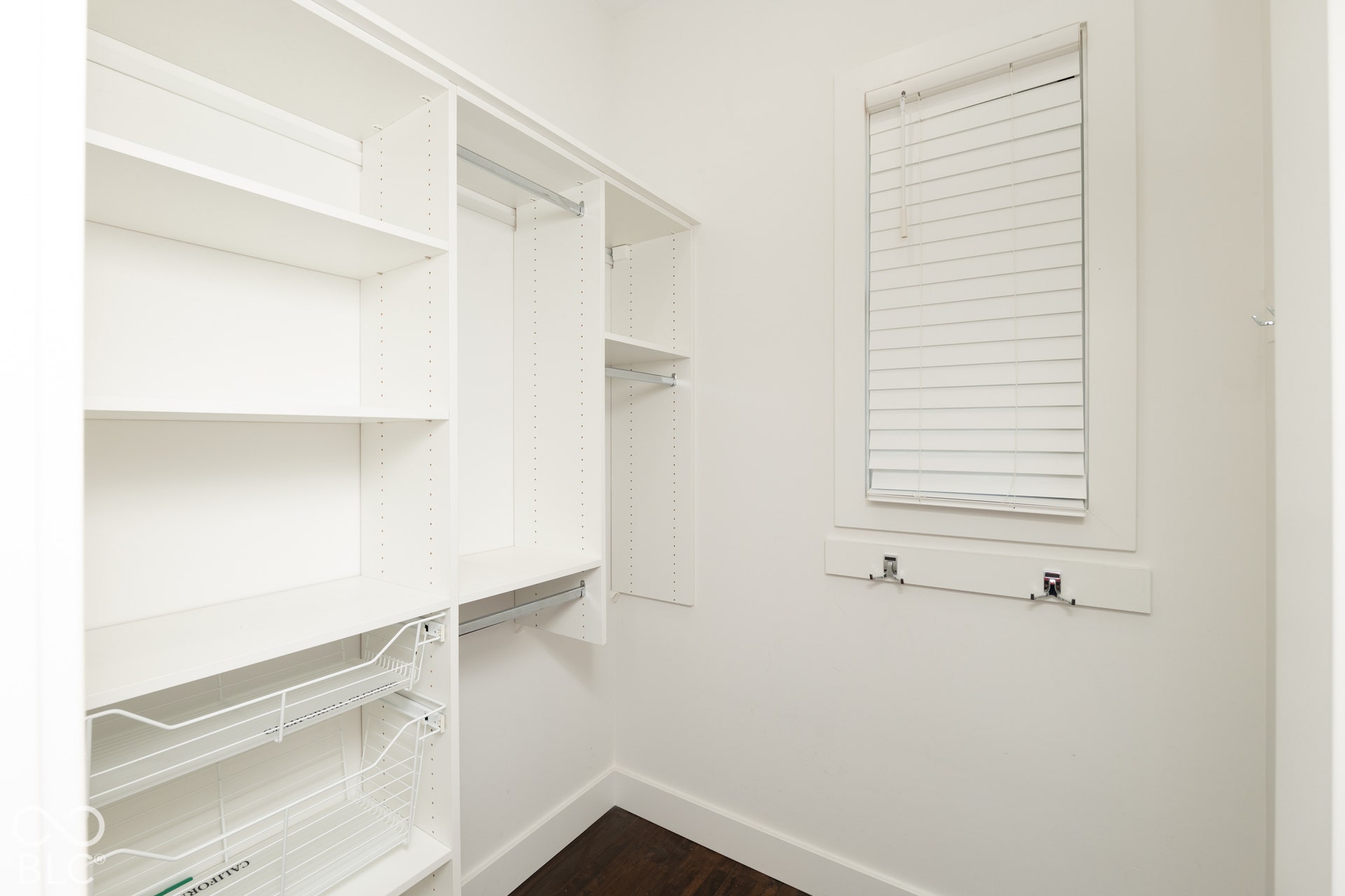 1401 Olive Street, Indianapolis, IN 46203 Spacious walk-in closet featuring built-in shelving, hanging rods, and wire storage drawers