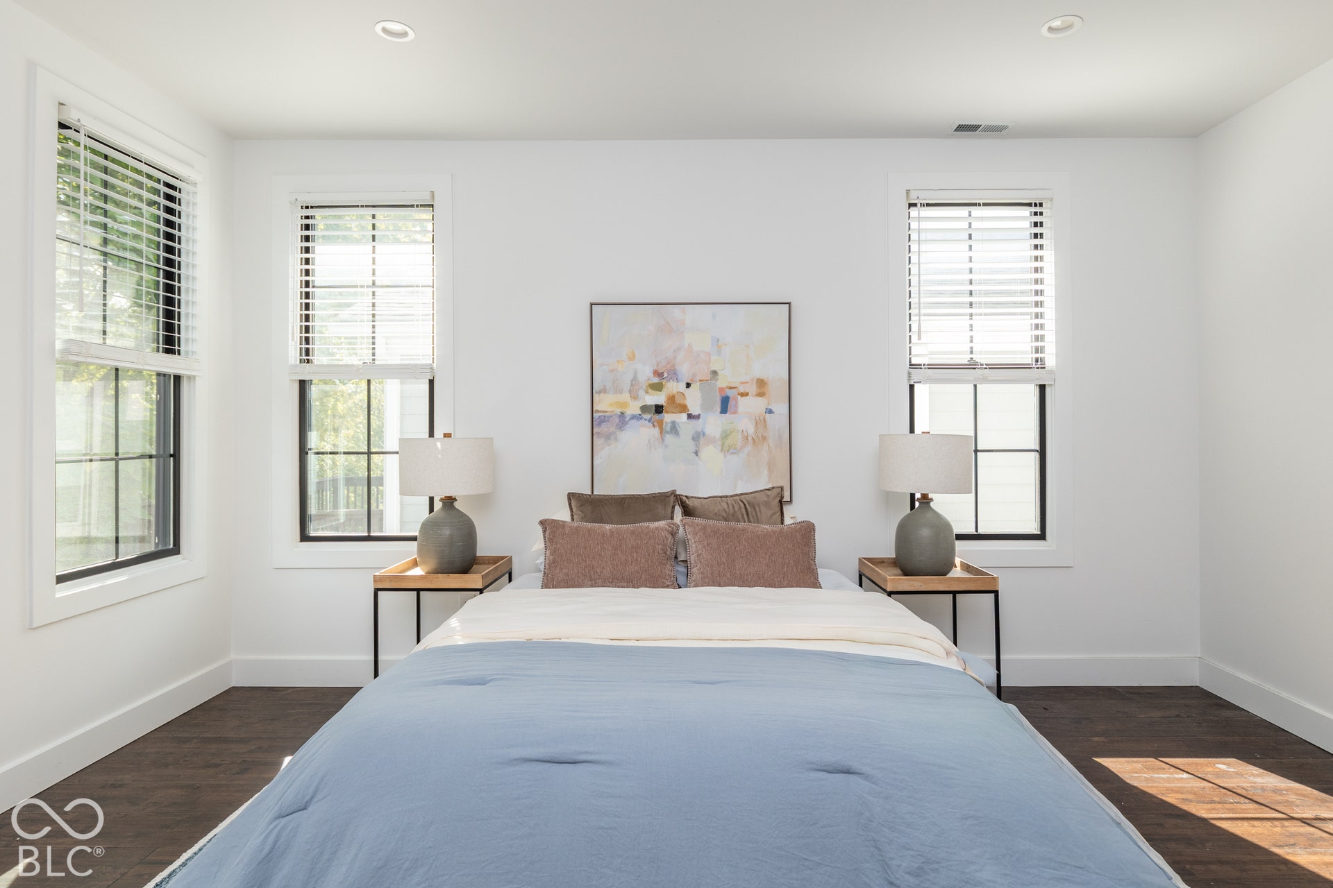 1401 Olive Street, Indianapolis, IN 46203 Neutral interior featuring dark wood-finish flooring, recessed lighting, and three windows with black-trimmed frames