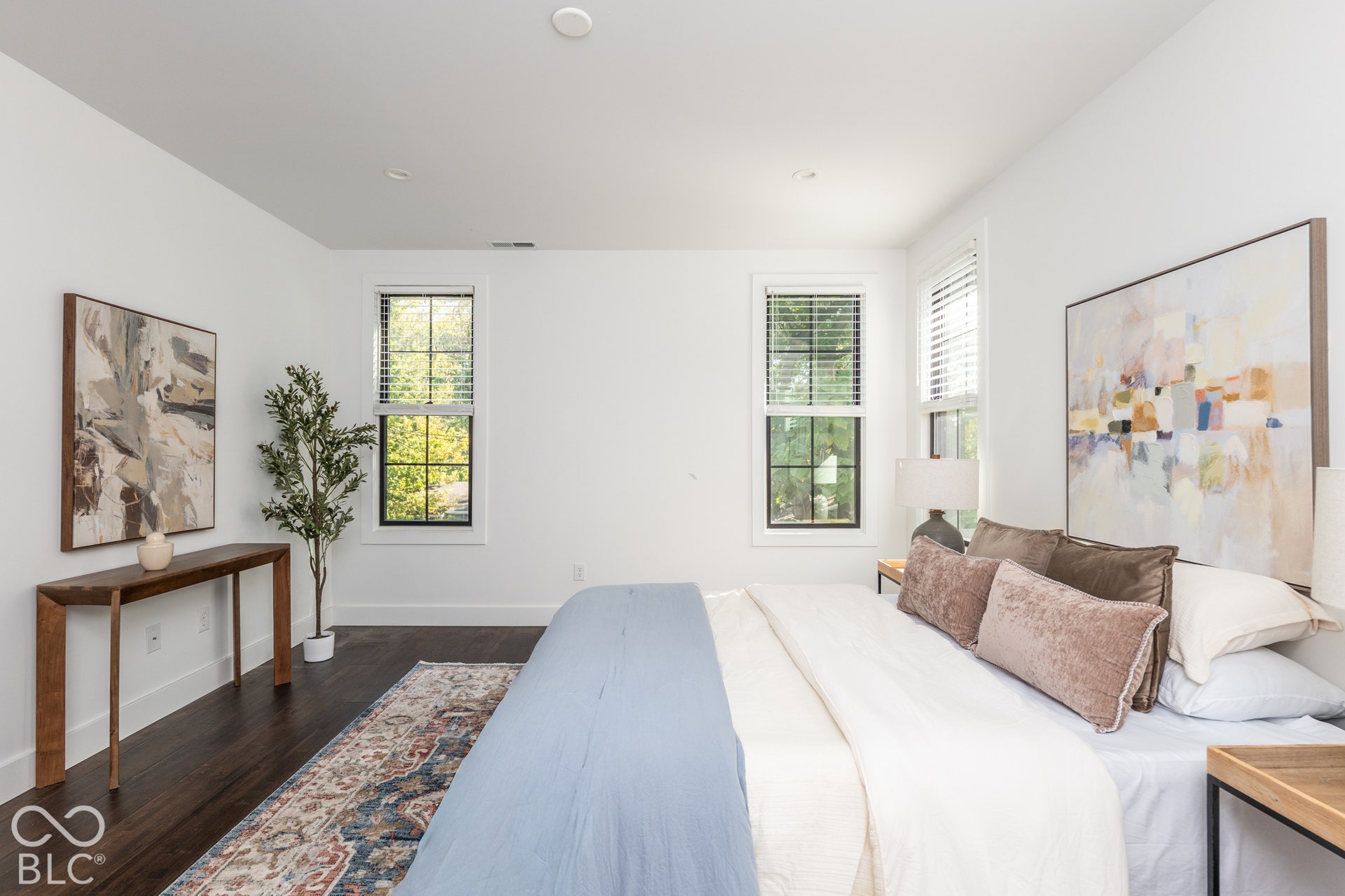 1401 Olive Street, Indianapolis, IN 46203 Bedroom featuring dark-toned wood-finish flooring, recessed lighting, and multi-pane windows with black frames