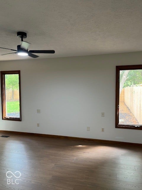 Primary Bedroom with view of backyard