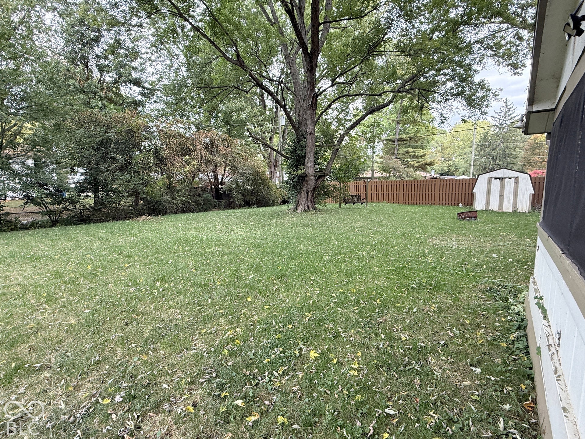 928 W 79th Street, Indianapolis, IN 46260 Virtually Altered - All fenced for your best canine (or kiddos) - huge yard - enjoy from the screened porch