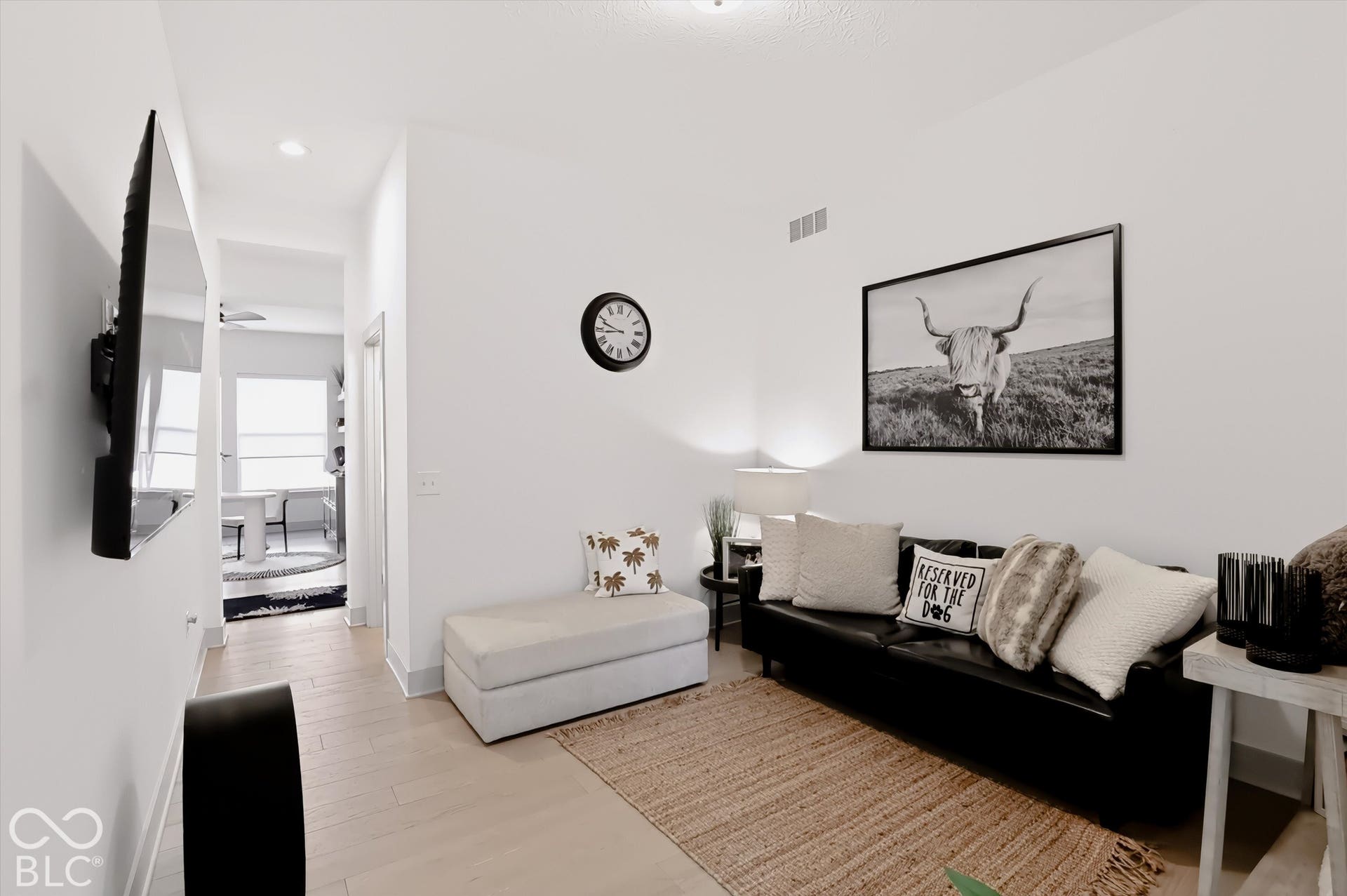 Neutral-toned interior featuring recessed lighting and light-finish flooring