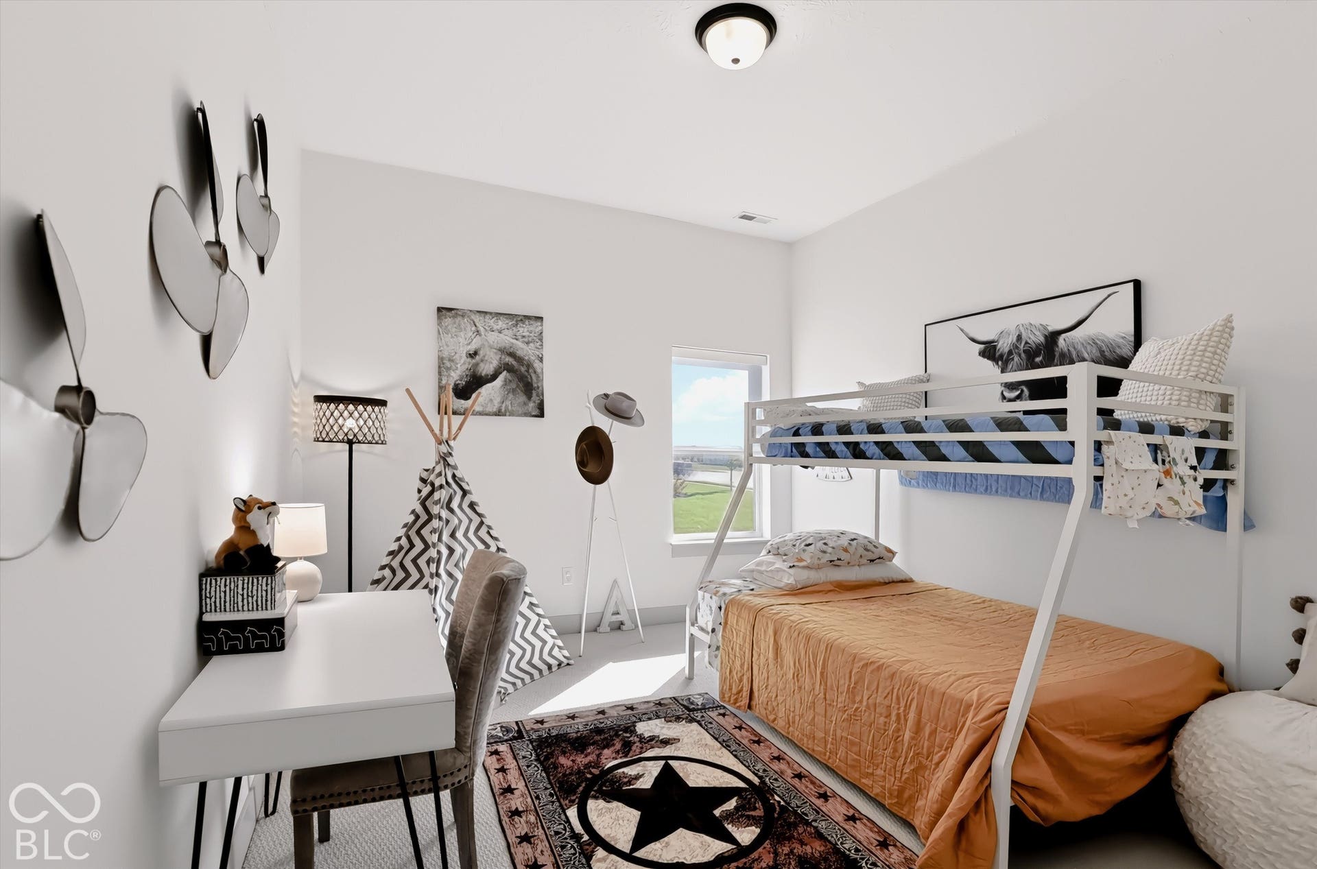 Room featuring neutral-toned walls, high ceilings, large window, and light-toned hard-surface flooring with a dome-style flush mount ceiling light fixture