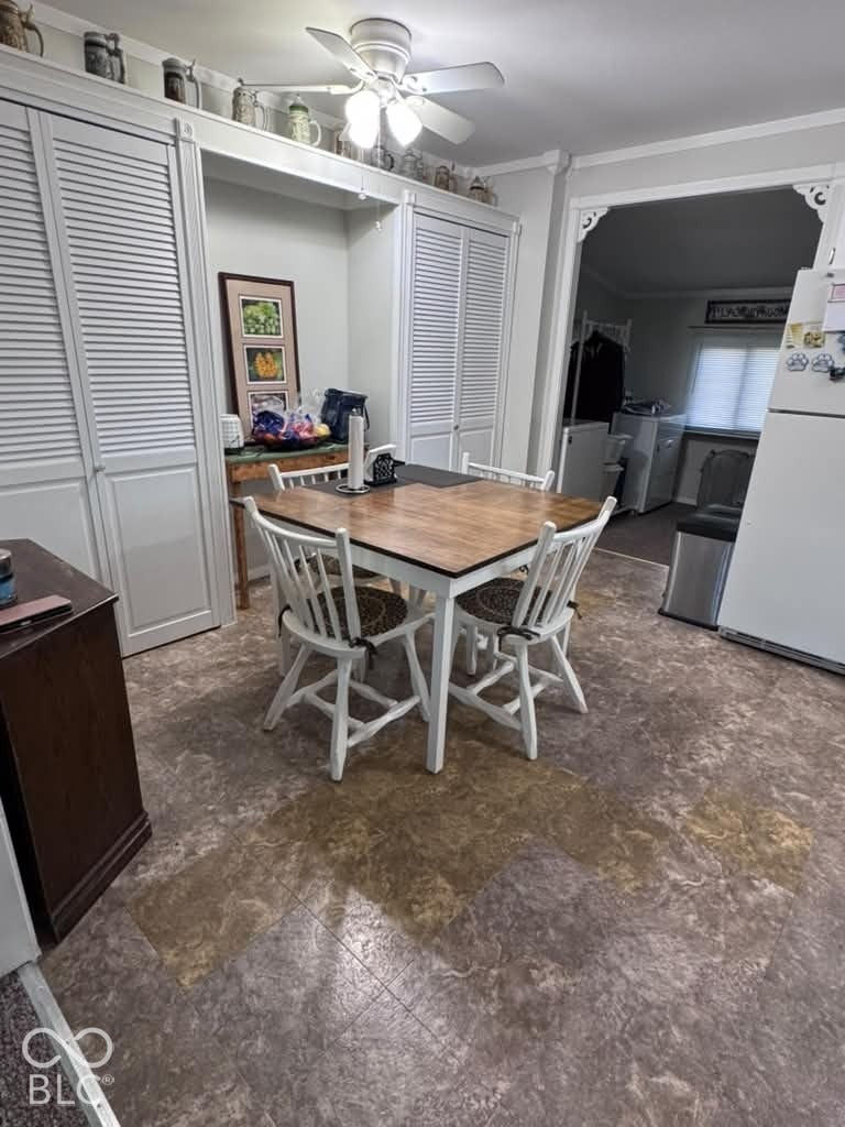 906 S Patterson, Lebanon, IN 46052 Built-in floor-to-ceiling cabinetry with louvered doors, multi-tone tile flooring, and a ceiling-mounted light fixture with integrated fan