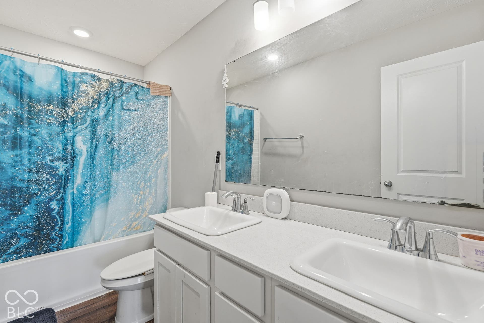 Upstairs bathroom with full tub and shower.